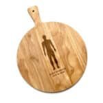 A light wooden serving board with a human silhouette and "SILENT WITNESS 27 CAST & CREW" engraved.