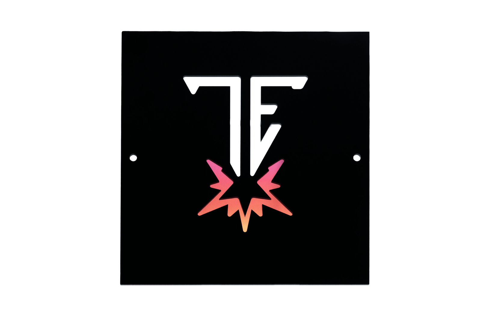 Black square sign with a white stylized 'TE' (Trade Engraving) logo and a pink-orange gradient burst design, isolated on white.