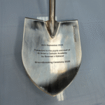 Engraved ceremonial spade for St Aidan's Catholic Academy groundbreaking ceremony 2025, presented by Bowmer + Kirkland.